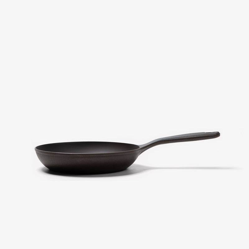 Side profile of the No.5 Field Cast Iron Chef Skillet showing its flared sides and long handle