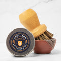 Field Tiny Ceramic Bowl in rust holding a chain mail scrubber, with scrub brush and seasoning oil tin thumbnail