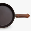 Overhead close-up of the Field Skillet handle wearing a brown leather handle cover thumbnail