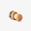 Field Natural Fiber Cleaning Brush on its side, showing beechwood knob handle and stiff bristles thumbnail