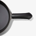 Black Field Leather Handle Cover with stitched tip fitted on the handle of the Field Skillet, seen from above thumbnail