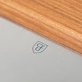 Close-up of the Field Bench Scraper's stainless blade with shield logo and cherry wood handle thumbnail