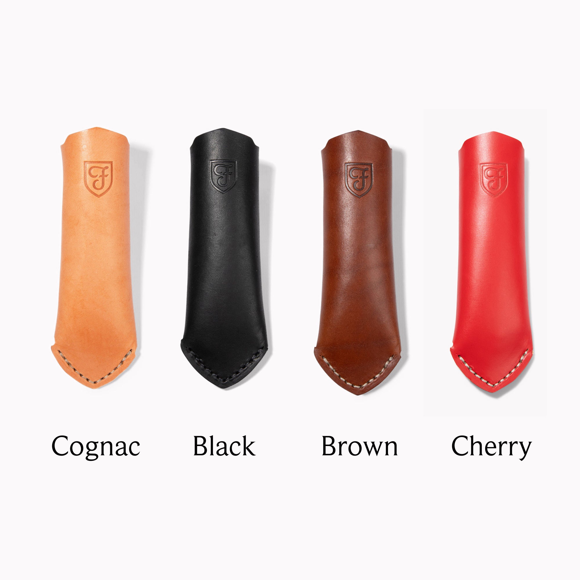 Field leather handle covers in cognac, black, brown, and cherry, laid flat with color labels