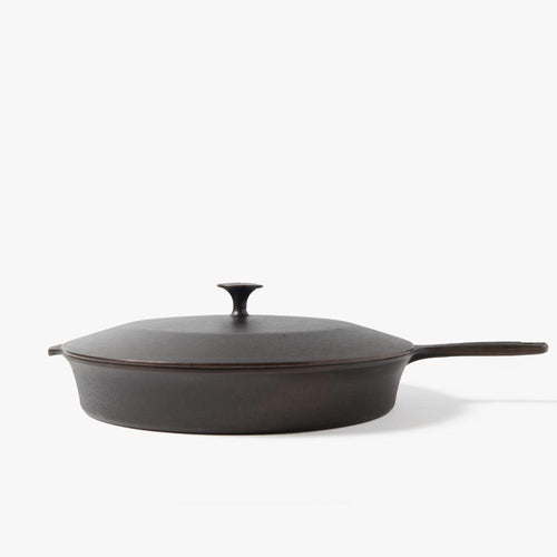 Side profile of the No.12 Field Cast Iron Skillet topped with its matching cast iron lid