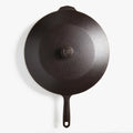 Overhead view of a Field Skillet topped with its cast iron lid and shield-stamped knob thumbnail