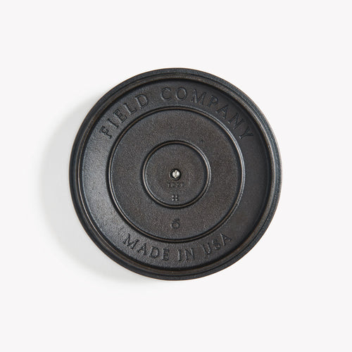 Underside of the No.6 Cast Iron Skillet Lid showing the Field Company and Made in USA stamps