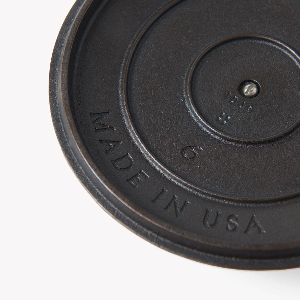Close-up of the No.6 Field Skillet Lid underside showing the Made in USA and size 6 stamps