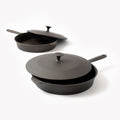 Two Field Skillets with cast iron lids resting slightly ajar, angled studio view thumbnail