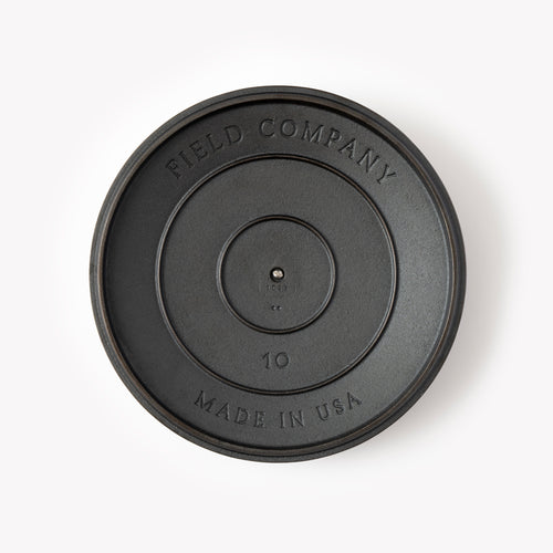 Top of the No.10 Cast Iron Skillet Lid showing the Field Company and Made in USA stamps