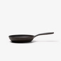 Side view of the Field Skillet showing its smooth low-profile shape and long curved handle thumbnail