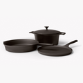 Angled view of the 4-Piece Field Cast Iron Cookware Set: lidded Dutch oven, skillet, and round griddle thumbnail