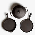 Overhead of the Field 4-Piece Set: lidded Dutch oven, skillet, and round griddle on white background thumbnail