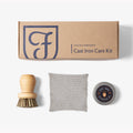 Field Company Cast Iron Care Kit box above the wood scrub brush, chain mail scrubber, and seasoning oil tin thumbnail