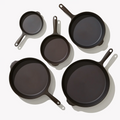 Overhead view of the five cast iron skillets and griddles in the Field Hosting Set thumbnail