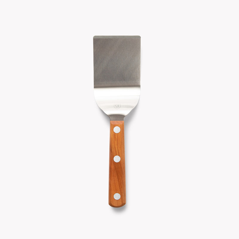 Overhead view of the Field Mini Turner with stainless blade and riveted cherry wood handle