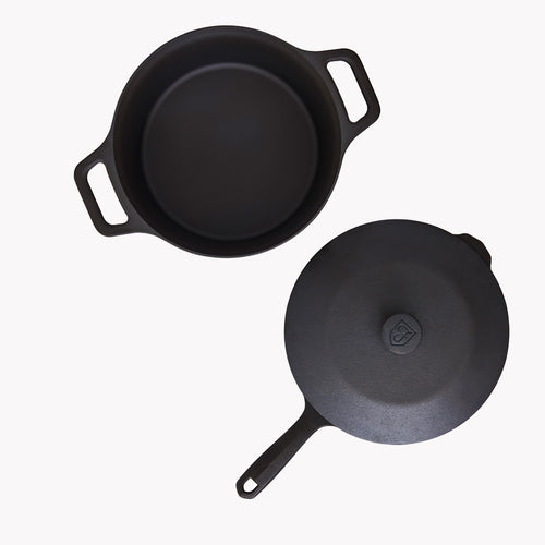 Overhead of the open Field Dutch Oven beside the lid-topped skillet from the 4-Piece Set