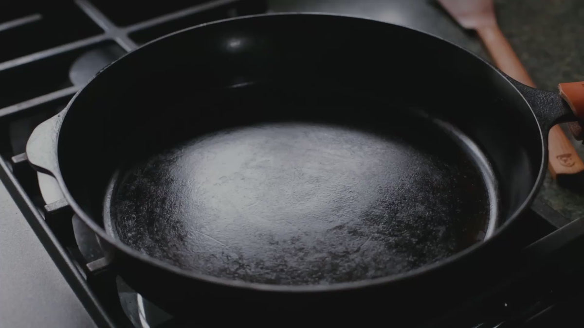 Video of soft scrambled eggs being stirred with a wooden spatula in a Field Skillet