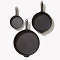 Overhead view of the three Field Skillets in the 3-Piece Cookware Set arranged on white thumbnail