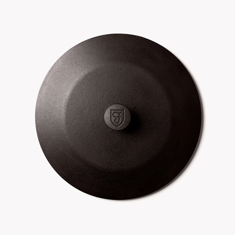 Overhead view of the No.10 Field Cast Iron Skillet Lid with shield-stamped center knob