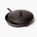 Cast iron lid resting slightly offset on the No.12 Field Skillet, angled view thumbnail