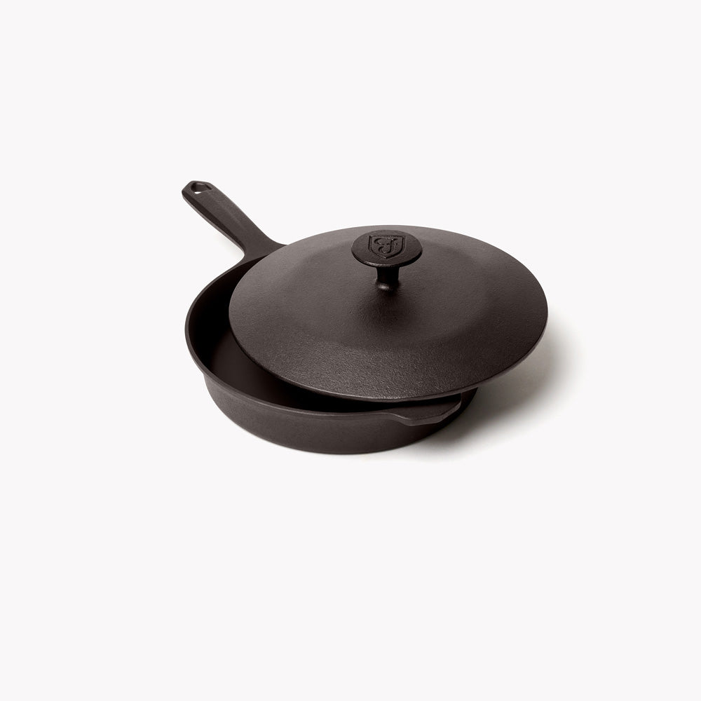 Angled view of the No.6 Cast Iron Skillet Lid with Field shield logo, resting on the matching skillet