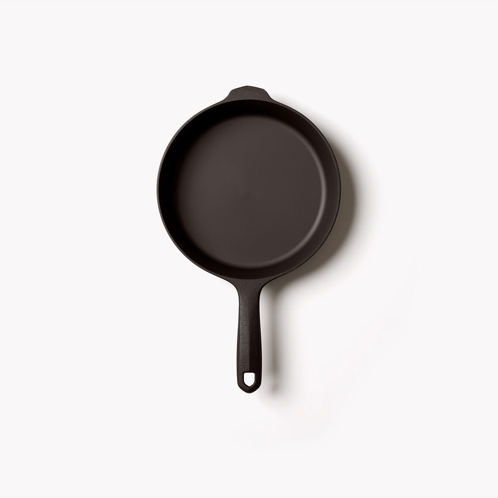 Overhead view of the No.6 Field Cast Iron Skillet on a white background, helper handle at top