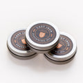 Three stacked tins of Field Company Cast Iron Seasoning Oil on a white background thumbnail