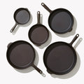 Overhead view of the 5-Piece Field Cast Iron Cookware Set, five skillet sizes arranged face up thumbnail