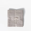 Field Company linen apron folded flat and tied with cotton string, studio shot thumbnail