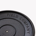 Close-up of the underside of a Field Cast Iron Skillet Lid showing the Field Company stamp thumbnail